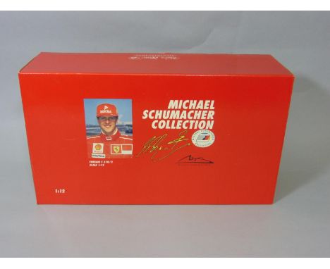 Ferrari F310/2 model racing car from the Michael Schumacher Collection by Pauls Model Art, 1:12 scale, boxed 