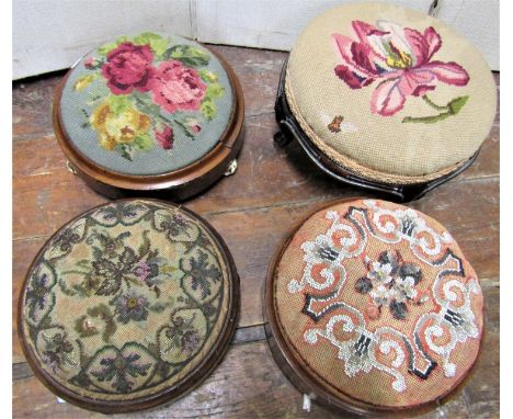 Four Victorian footstools all of circular form, two with beadwork detail, two with tapestry detail 