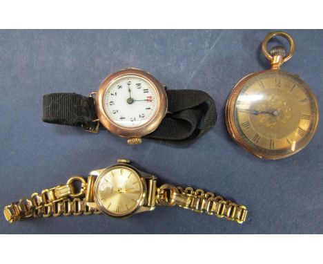 Early 20th century 9ct lugg watch, the enamel dial with Arabic numerals and gilt reeded decoration on a fabric bracelet (AF) 