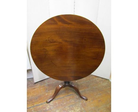 A Georgian mahogany snap top table, the circular top 82 cm diameter raised on a gun barrel pillar and tripod base with birdca