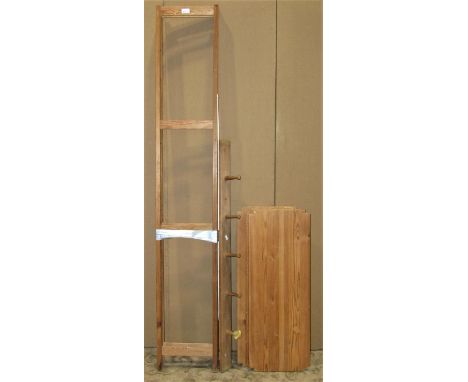A simple stripped pine framed shelving unit comprising two ladder uprights supporting five shelves (dismantled) 179cm high x 