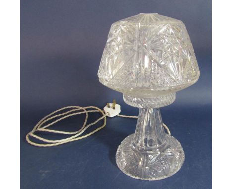 Probably Waterford crystal lamp, the tapered shade with star cut top over a faceted tapered column and circular base, 33 cm h