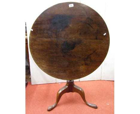 A Georgian oak snap top occasional table, the circular top raised on a turned pillar and tripod, the top 75cm 