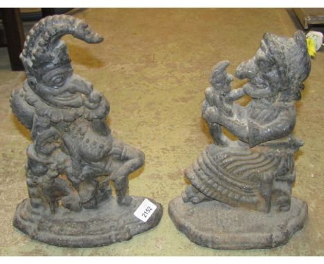 A vintage matched pair of cast iron Punch and Judy door porters 