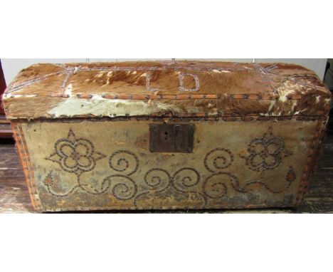 An 18th century travelling trunk with pony skin finish, the domed lid monogrammed LD and dated 1727, with leather strip and s