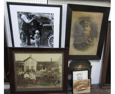 A sepia photograph of an early 20th century American family group, seated outside a house beside a motorcar, 41 x 50.5cm appr