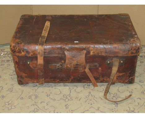 A vintage heavy gauge stitched brown leather suitcase, stamped Finnigan Maker Manchester (worn) approx 85cm long x 50cm wide 