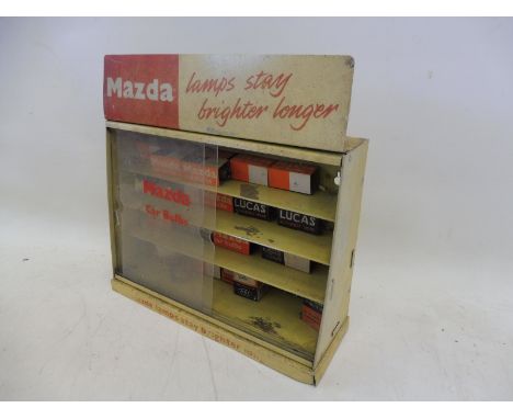 A Mazda Car Bulbs counter top dispensing cabinet, with some contents.