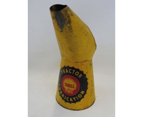 A Shell Tractor Lubrication quart measure.