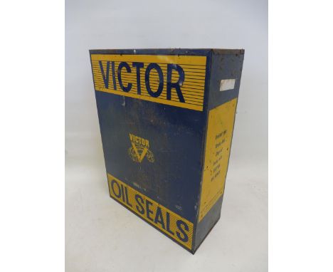 A Victor Oil Seals counter top dispensing shelf, 15 1/4" wide x 21" high x 7" deep.