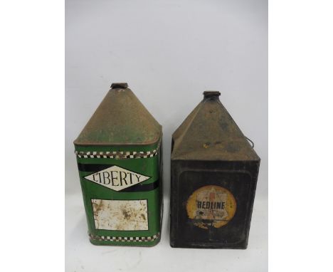 A Liberty Oils five gallon pyramid can and a Redline five gallon can.