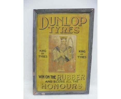 A very rare Dunlop Tyres showcard in the form of a playing card set within it's original grey plaster frame embossed all roun