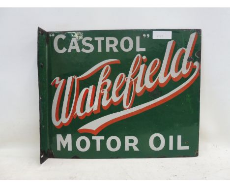 An early and rare Wakefield Castrol Motor Oil double sided enamel sign with hanging flange, with script writing, the sign mad