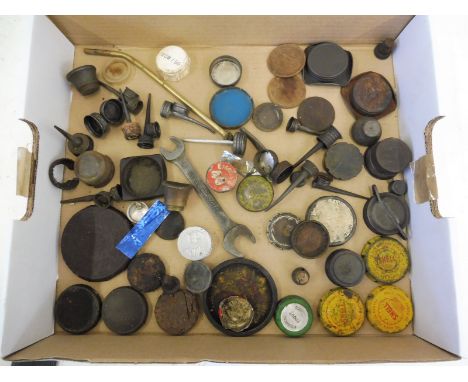 A selection of assorted oil bottle and can lids, caps and fittings etc. also a Nissan Motor double ended spanner. 