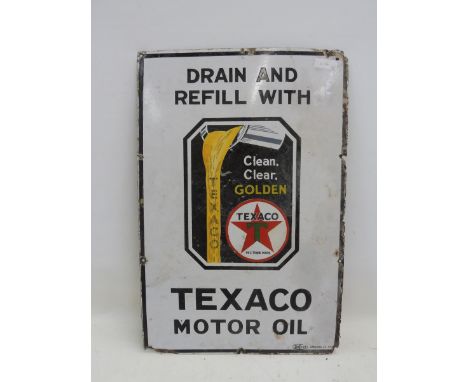 A Texaco Motor Oil rectangular enamel sign with central image depicting oil pouring from a jug, with some restoration, 20 x 3