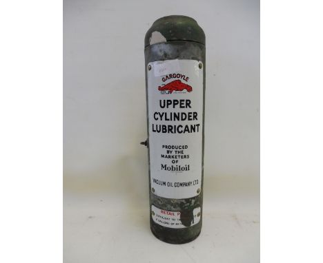 A Mobiloil Upper Cylinder Lubricant wall mounted dispensing cabinet with gun inside.