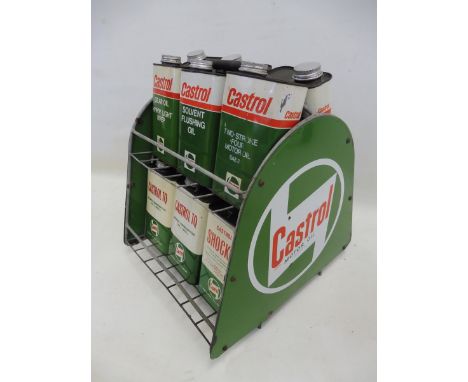 A Castrol Motor Oil forecourt crate with enamel signs to each end containing an asssortment of 12 quart rectangular cans.