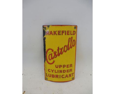 A Wakefield Castrollo Upper Cylinder Lubricant curved enamel sign for the front of a cabinet, 4 x 7".