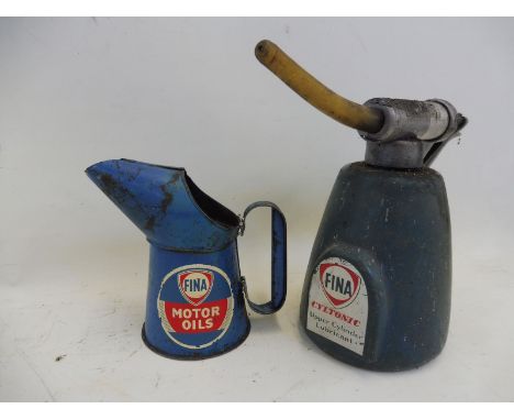 A Fina Motor Oils pint measure with detached handle and a Fina Cyltonic Upper Cylinder Lubricant dispensing gun. 