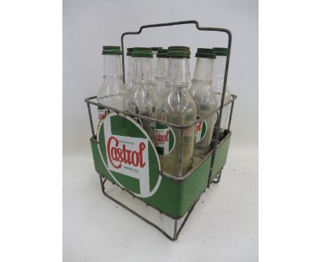 A Wakefield Castrol Motor Oil nine bottle crate with enamel signs all round and nine correct Castrol bottles, with good label
