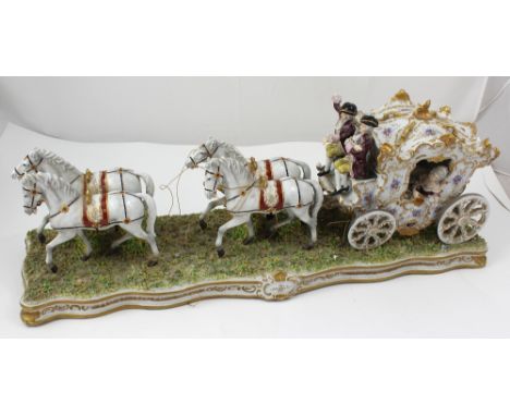 A Naples porcelain carriage and four, depicting 18th century figures including a lady in crinoline inside the carriage and tw