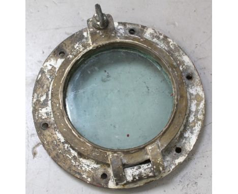 A bronze hinged ship's portal bearing tie on label from Humberts Ship Repairers Ltd, marked 'TSS Invicta', diameter 42cm.