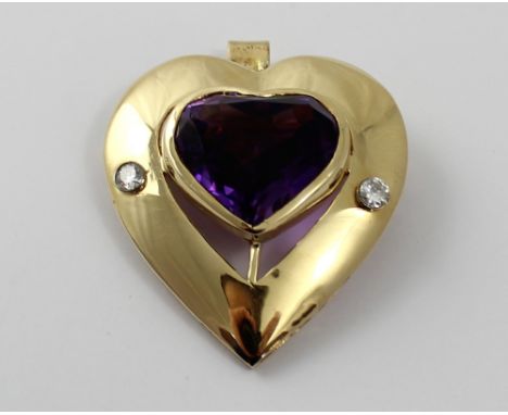 A large 9ct gold heart-shaped pendant/brooch, heart-shaped central amethyst flanked by a pair of two-point diamonds, approx 2