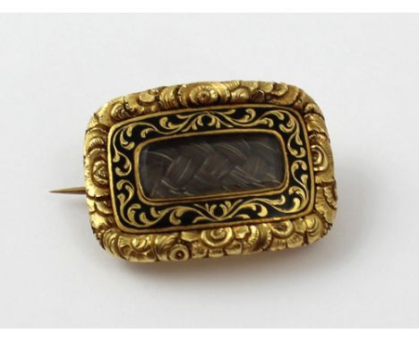 A 19th century gold and black enamel mourning brooch with hair plait compartment, inscription to the back rubbed, approx 5.5g