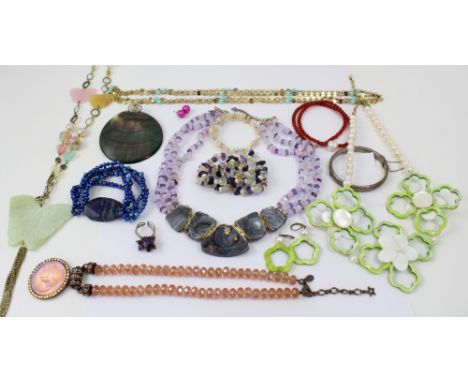 A cased semi-precious stone necklace containing quartz, rose quartz and amethyst and a selection of other semi-precious and p