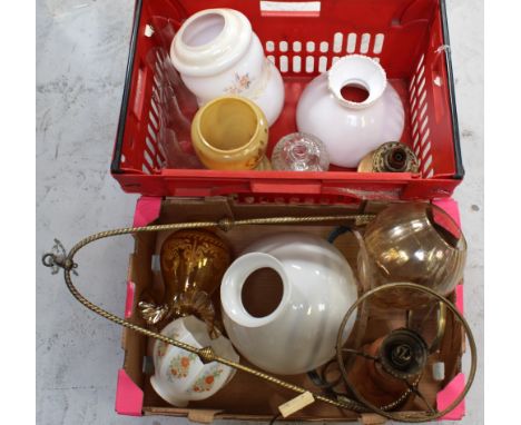 A collection of vintage glass shades, glass smoke stacks for a paraffin lamp and a latte glass paraffin lamp with brass singl