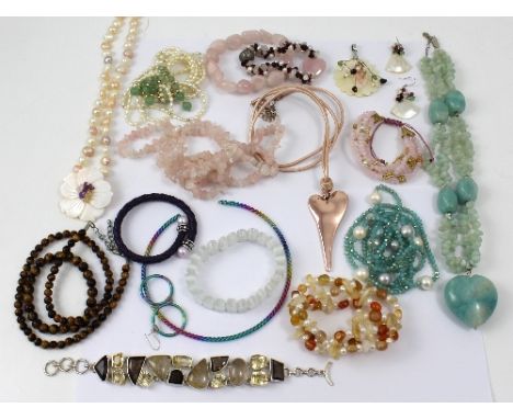 A collection of necklaces, bracelets, and earrings to include semi-precious stone sets of quartz, amethyst, tiger's-eye and f