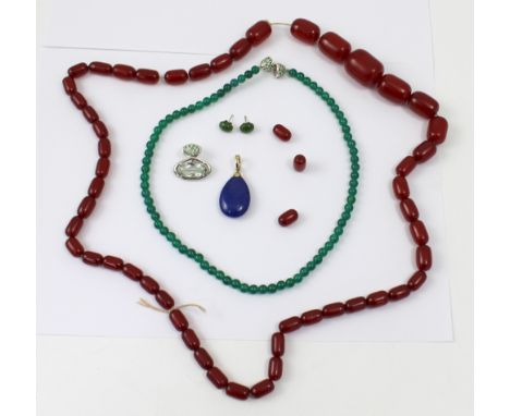 A cherry amber-style bead necklace, a jade-coloured bead necklace with pendant and a 9ct gold mounted lapis lazuli teardrop p