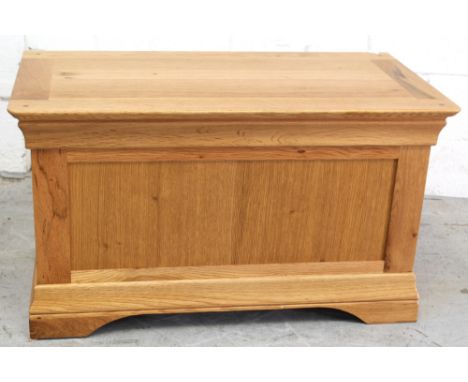 A modern light oak blanket box/ottoman, 52 x 90cm.
