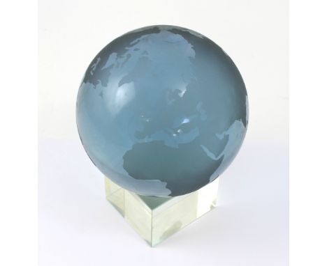 An etched amethyst glass terrestrial globe on clear glass stand, diameter 13.5cm, height 20cm.