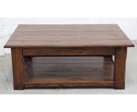 A large modern distressed oak coffee table with shelf stretcher, 36 x 120cm.