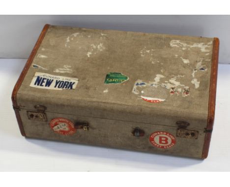 A vintage travel case with 'White Star New York Cunard Line First Class', 'Cunard White Star First Class', 'Cunard White Star