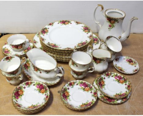 A quantity of Royal Albert 'Old Country Roses' pattern tea and dinner ware comprising four meat plates, sauce boat and stand,