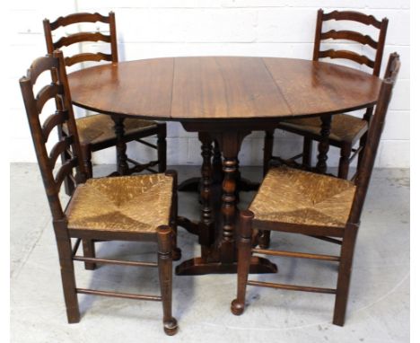 An early-to-mid 20th century oak gate-leg dining table on wrythen supports and stretchers, length when extended 147cm and fou