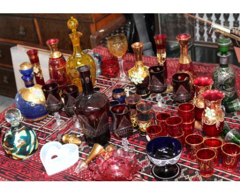 A quantity of coloured glass including Whitefriars, Mdina, cranberry etc and a quantity of Bohemian and similar, some with fl