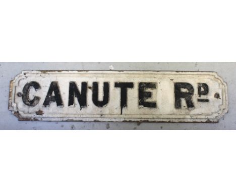 A cast iron vintage street sign 'Canute Rd', 18 x 75cm.