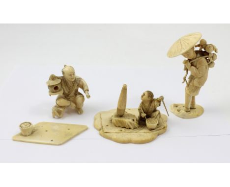 A 19th century carved ivory farmer or peasant with character mark to base, height 11cm and two seated figures, the first a ma