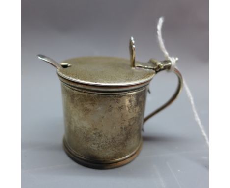 A silver mustard pot, marked Chester 1793/9 'S.I.LD' together with a sliver mustard spoon marked Birmingham 1918/9 'J.C Ltd',
