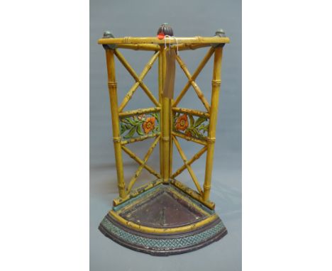 An early 20th Century painted cast iron stick stand in the from of bamboo sticks