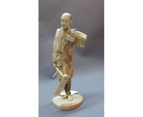 A 19th Century Japanese ivory okimono of a farmer with an axe, bears mark to vase