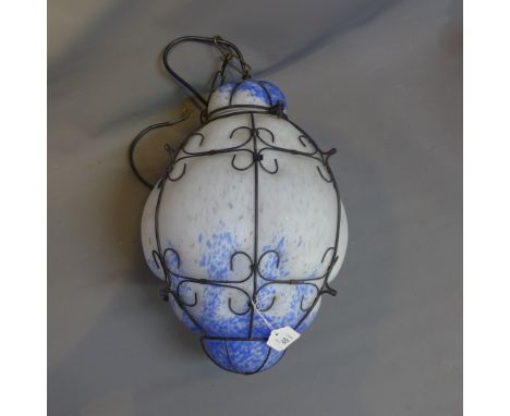 An art glass and iron bounded ceiling light shade