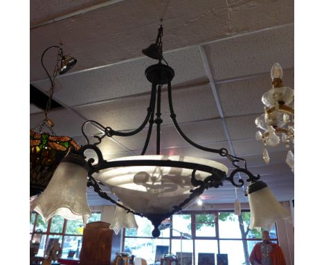 A frosted glass bowl ceiling light having frosted glass fluted shades and dragon decoration