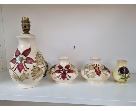 Moorcroft Floral decorated lamp base, Pair of matching vases and a Squat vase with impressed marks 