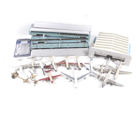 An assortment of diecast aircraft and a model of an airport. The planes including a Dinky Viscount (repainted), a Dinky Super
