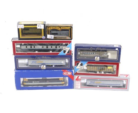 A mixed OO gauge collection of vehicles. Including a Heljan Scotrail diesel locomotive and a selection of mainly Lima coaches
