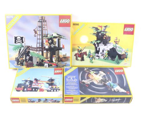 A collection of four Lego Legoland sets. Comprising one Helicoptor and truck no. 6357, one light and sound system spaceship n